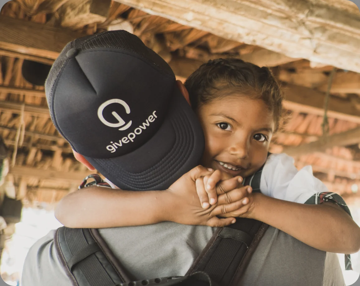 A child wearing a GivePower cap